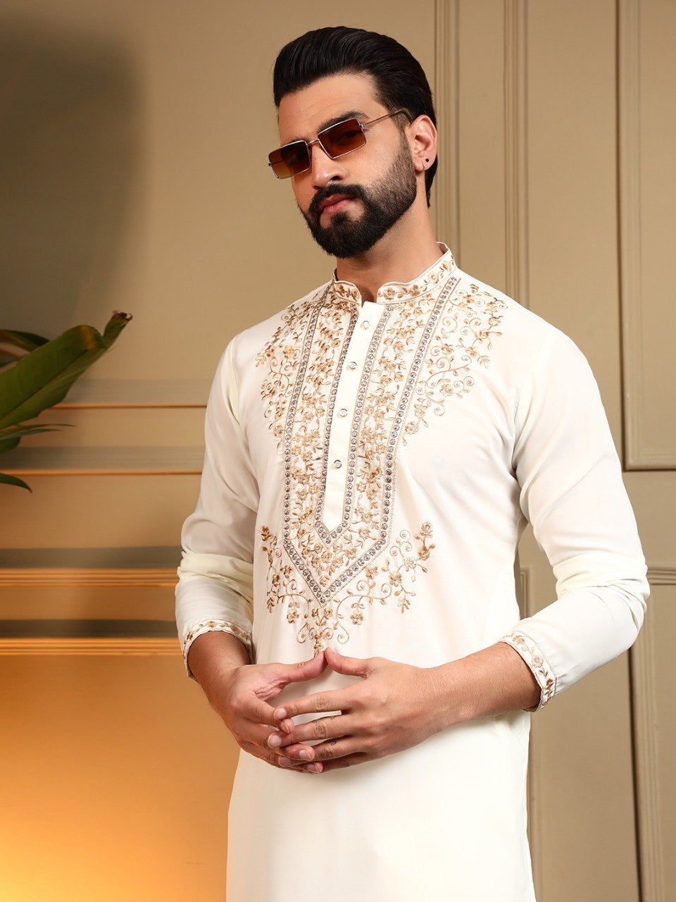 Men's sequins embroidered kurta and pants set by HOUSE OF KURTAS, featuring intricate embroidery and stylish design.