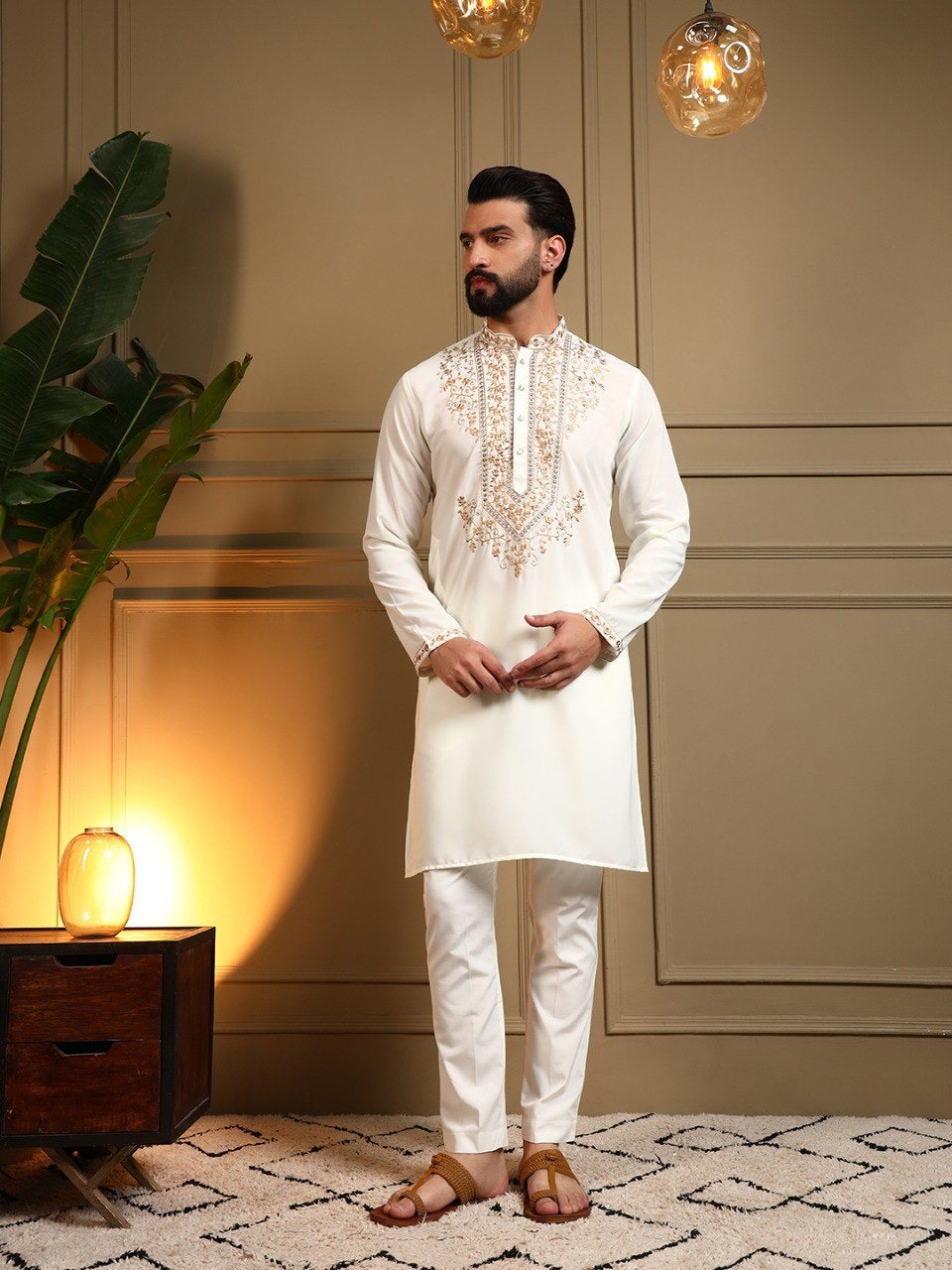 Men's sequins embroidered kurta and pants set by HOUSE OF KURTAS, featuring intricate embroidery and stylish design.